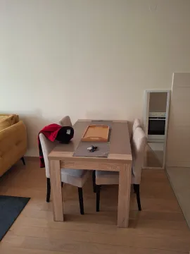 Dining table with chairs in the living room. - image 7