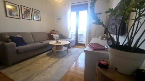 Living room with a sofa, coffee table and access to the terrace. - image 8
