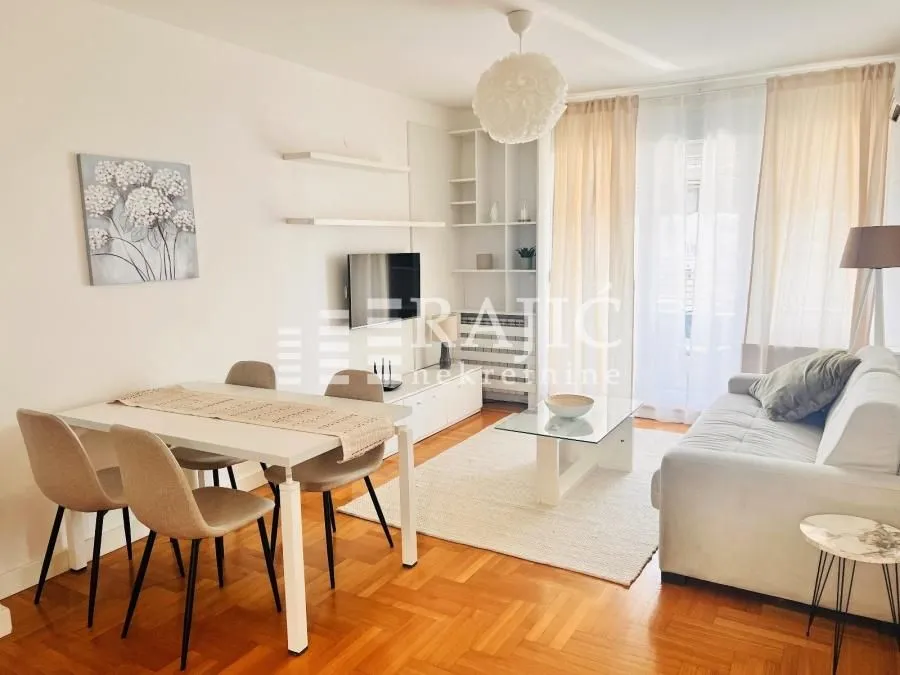Bright living room with a dining area and seating set.