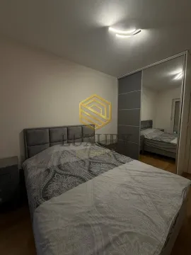 Bedroom with a double bed and a built-in mirrored wardrobe. - image 2