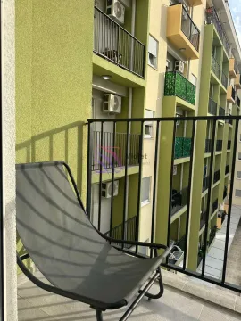 View from the balcony overlooking the building facade and surrounding terraces. - image 8