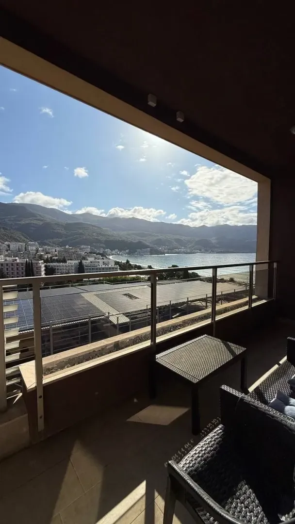 Furnished terrace with a view of the sea and mountains.