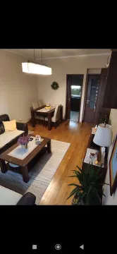 Furnished living room with a dining area. - image 4