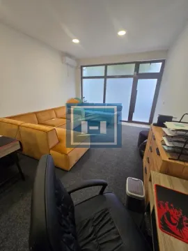 Living room with a sofa set and a desk. - image 6