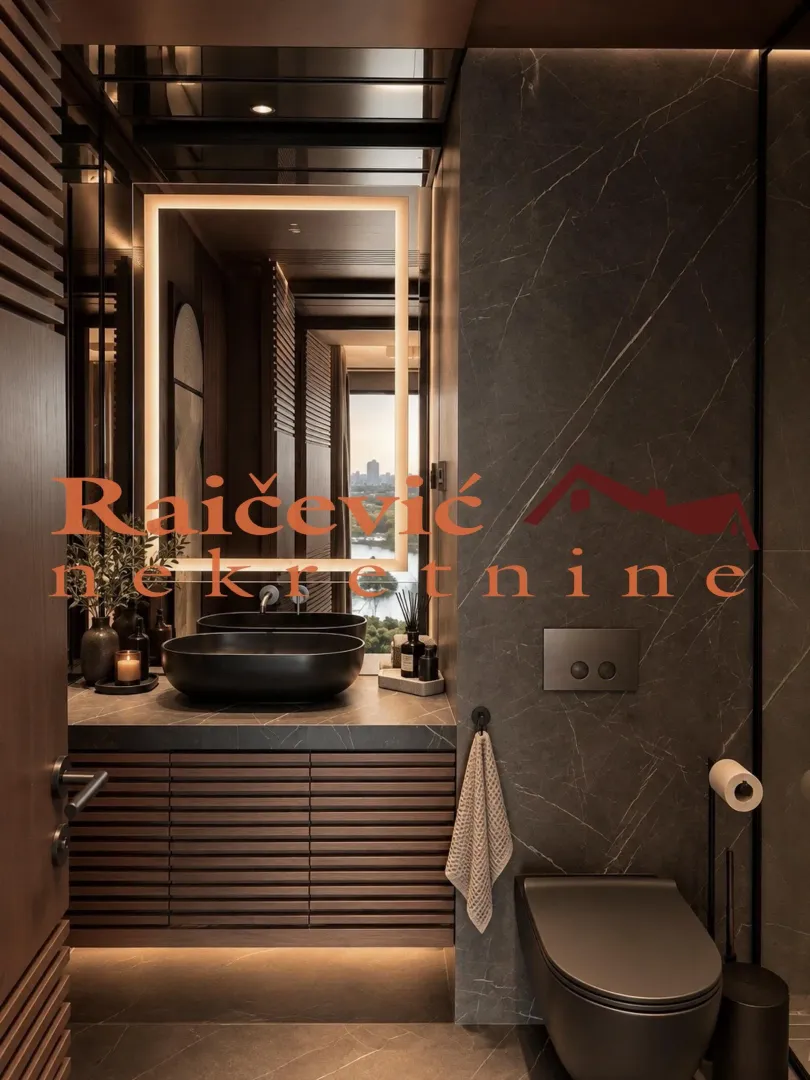 Modern bathroom equipped with dark sanitary fixtures and a large backlit mirror.