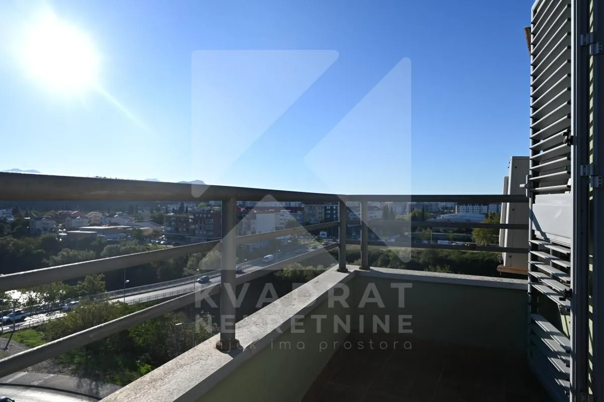 View from the balcony overlooking the surrounding neighborhood and city.