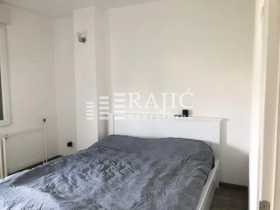 Bright bedroom with a double bed.