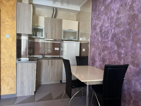 Kitchen with a dining table and chairs. - image 5