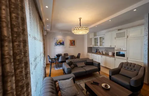 Living room connected to the dining area and kitchen in bright tones. - image 13