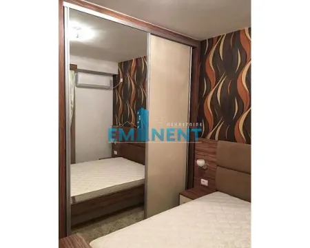 Furnished bedroom with a large mirrored wardrobe. - image 3