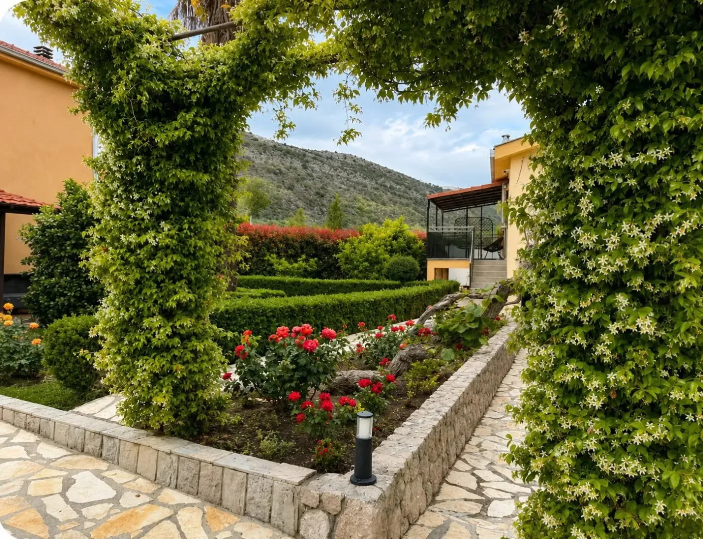 A beautifully landscaped yard with greenery and flowers.