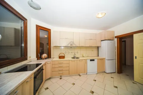 Equipped kitchen with wooden cabinetry and built-in appliances. - image 5