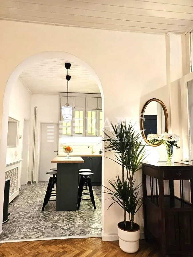 View from the living room towards the kitchen with a dining island.