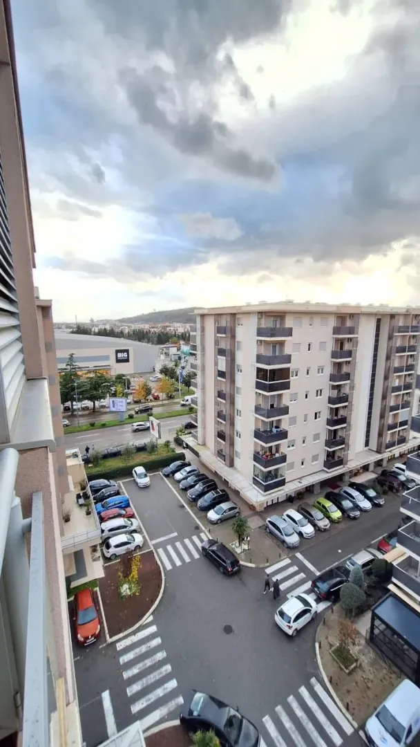 View from the terrace on the city neighborhood and parking lot.