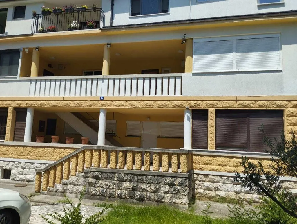 View of the exterior of the building with terraces and stairs.