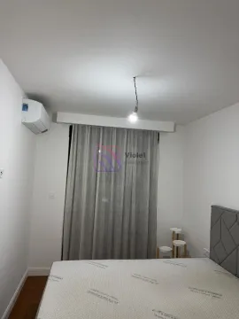 Bedroom with a bed and an air conditioning unit. - image 9