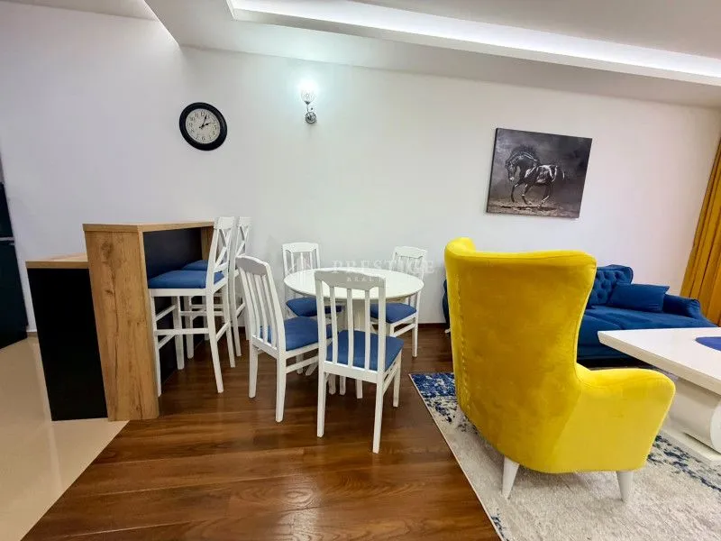 Spacious living room with a dining area and modern furniture.