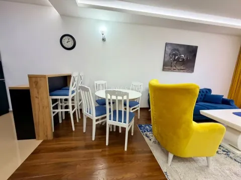Spacious living room with a dining area and modern furniture. - image 4