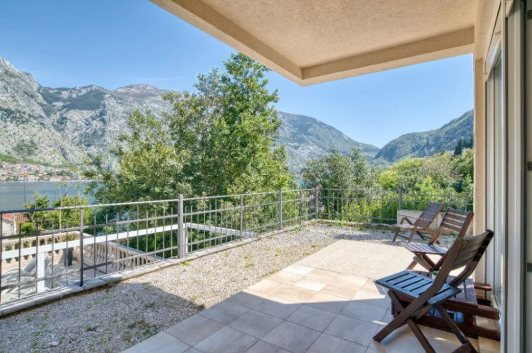 Spacious terrace with a view of the mountains and bay.