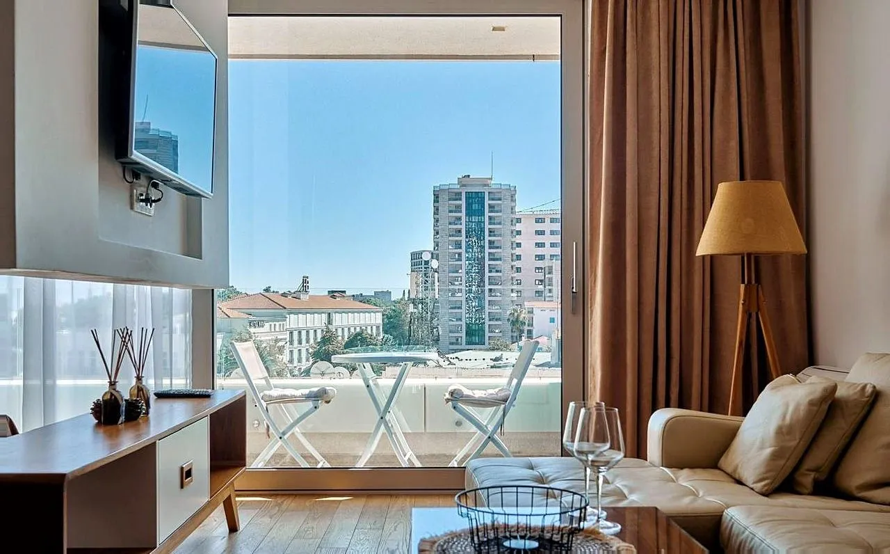 Living room with a sofa and access to the terrace.