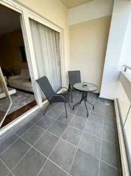 Unfurnished terrace with a table and two chairs. - image 5