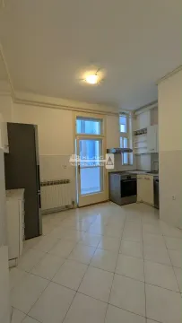 Kitchen with cabinetry, refrigerator, and access to the terrace. - image 3