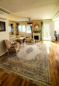 Spacious living room with seating set and fireplace. - image 4