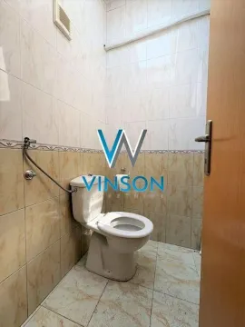 Smaller bathroom tiled with ceramic tiles featuring a toilet bowl. - image 7