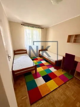 Children's bedroom with two single beds and a desk. - image 2