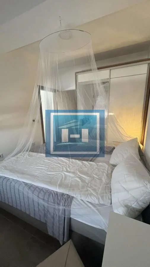 Bedroom with a double bed and a canopy.