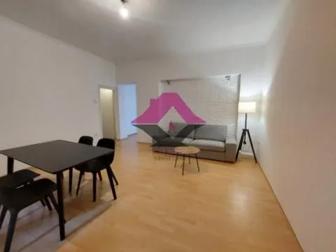 Spacious living room with a dining table and a seating set. - image 3
