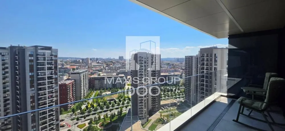 Spacious terrace with seating furniture and a city view.