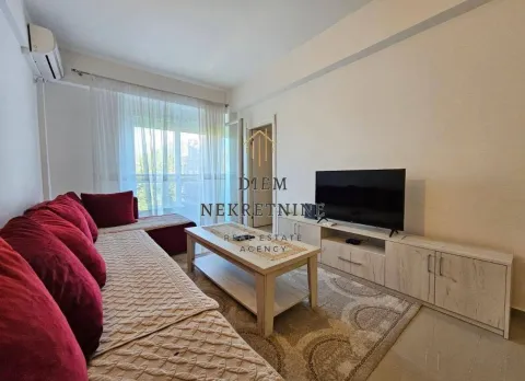 Living room with a sofa set and a TV. - image 3