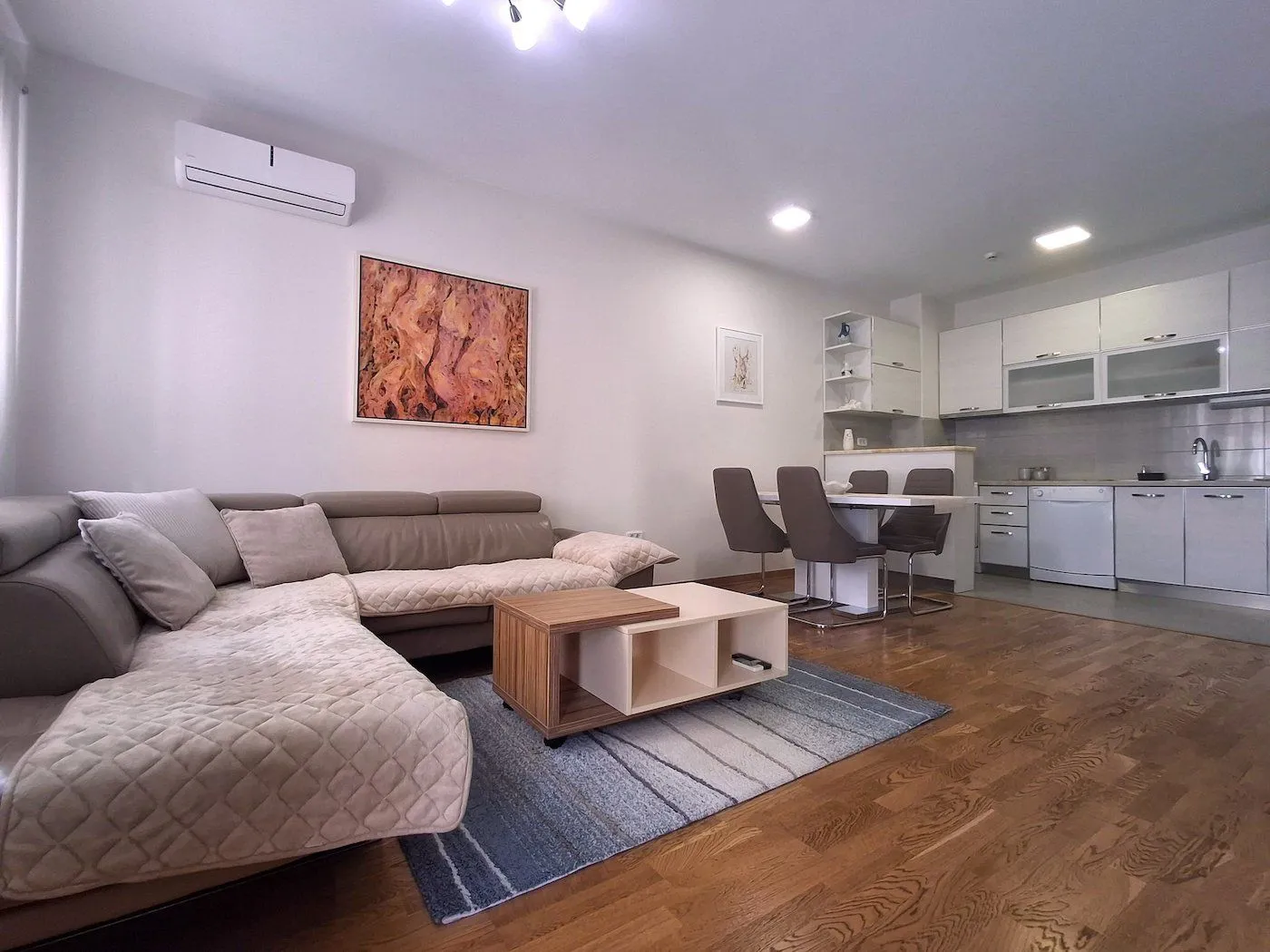 Living room connected to the dining area and kitchen.