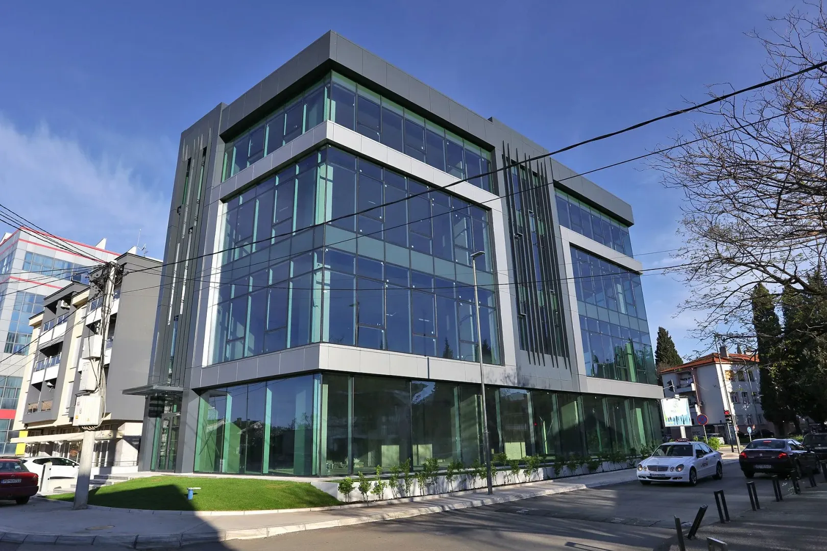 View of a modern commercial building with a glass facade.