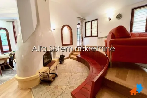 Living room with a fireplace and a wooden bench. - image 8