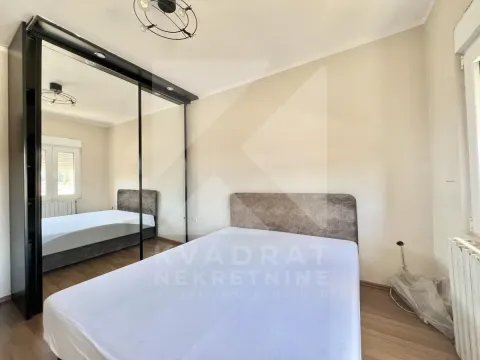 Bedroom with a double bed and a large mirrored wardrobe. - image 9