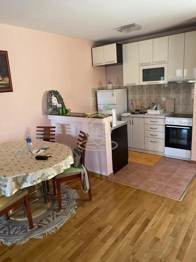 Kitchen with a dining area and built-in appliances.