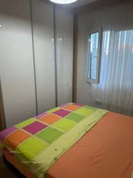 Smaller bedroom with a bed and a built-in wardrobe. - image 9