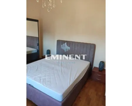 Furnished bedroom with a double bed and nightstands. - image 11
