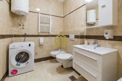 Fully equipped bathroom with sanitary fixtures, washbasin, and washing machine. - image 8