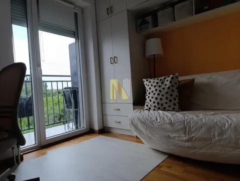 Living room with a sofa, built-in wardrobe and access to the balcony. - image 6