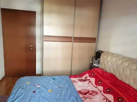 Simple bedroom with a built-in wardrobe. - image 9