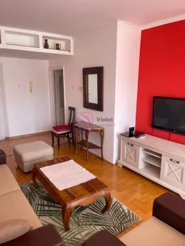 Living room with sofa set, TV unit, and red accent wall. - image 3