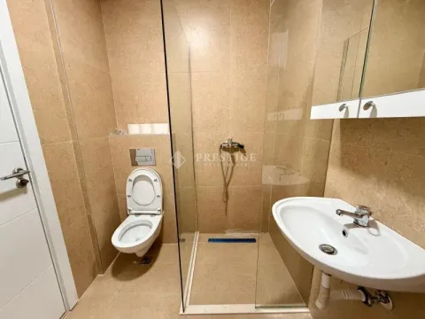 Modern tiled bathroom with a walk-in shower. - image 12