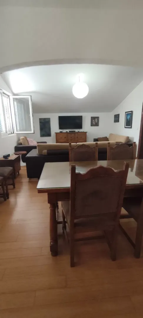 Spacious living room with a dining area and seating set.