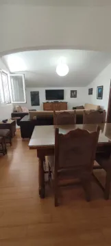 Spacious living room with a dining area and seating set. - image 8