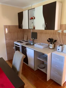 Smaller kitchen with cabinetry and sink. - image 18