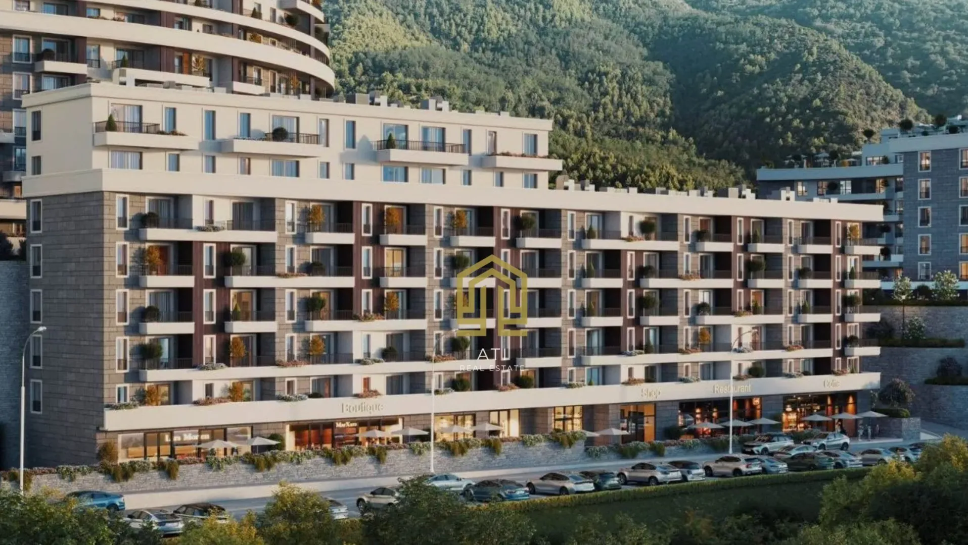 Spoljašnji izgled moderne stambene zgrade sa terasama i zelenilom u pozadini.
