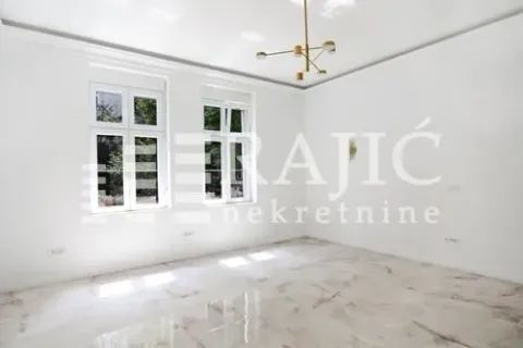 Empty bright room with windows and a modern chandelier. - image 6